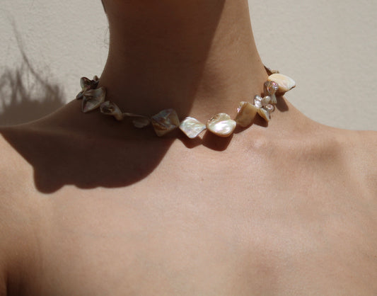 Exquisite mother of pearl shell necklace, showcasing unparalleled uniqueness and natural beauty in its design.