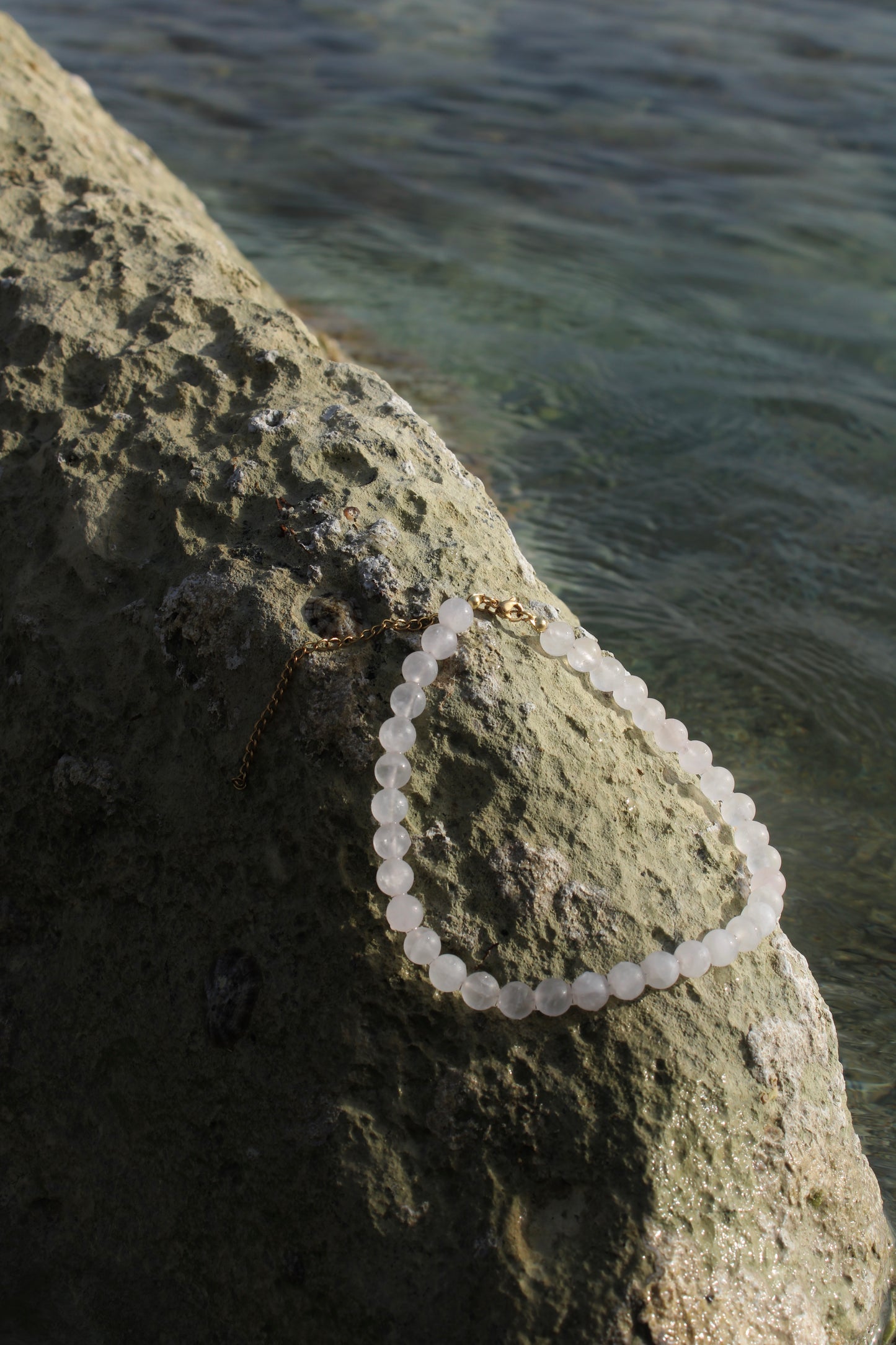 Pale pink quartz necklace, delicately crafted for a subtle yet radiant touch of femininity.